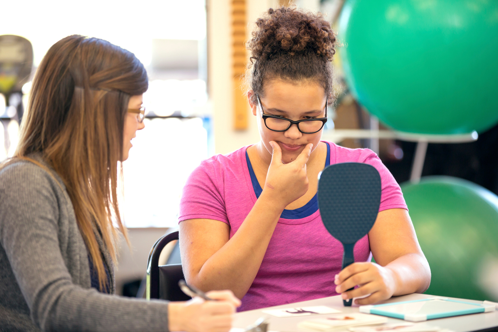 Young female in a speech therapy exercise